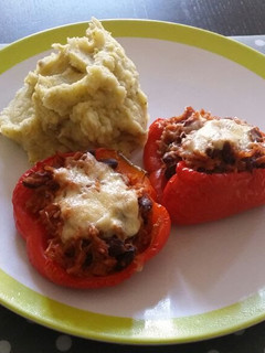 A picture of Stuffed Bell peppers with mashed potatoes.