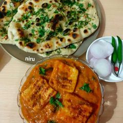 A picture of Paneer Butter Masala And Butter Naan.