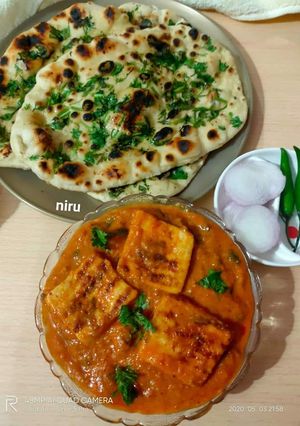 A picture of Paneer Butter Masala And Butter Naan.