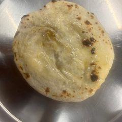 A picture of Alu paneer kulcha.