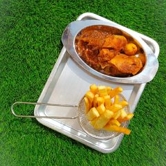 A picture of Yam fingers with spicy chicken sauce.