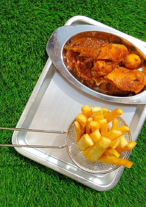 A picture of Yam fingers with spicy chicken sauce.