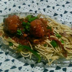 A picture of Manchurian with veg noodles.