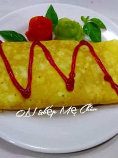 Hình của món Cơm chiên cá mòi bọc trứng.