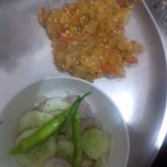 Punjabi Baingan Bharata with salad A picture of Punjabi Baingan Bharata with salad.
