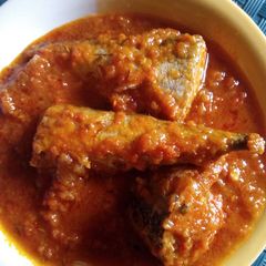 A picture of Tomato stew with fresh titus fish.