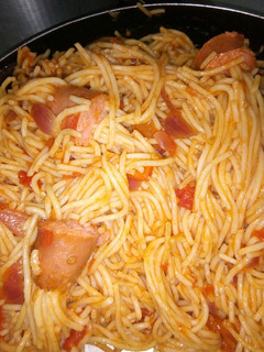 A picture of Threaded spaghetti hot dog bites in sauce.