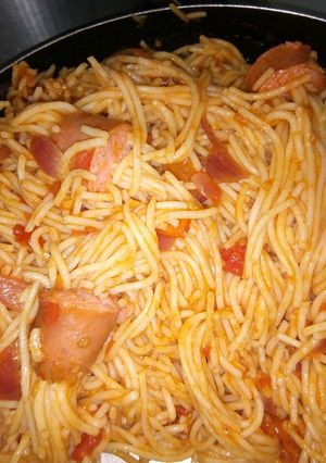 A picture of Threaded spaghetti hot dog bites in sauce.