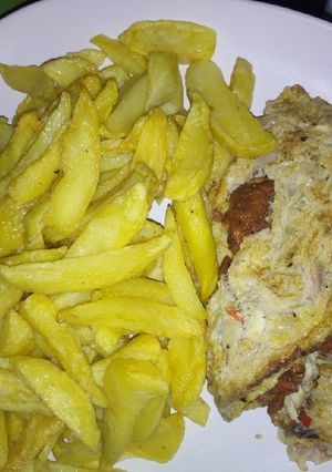 A picture of Chips and fried eggs.