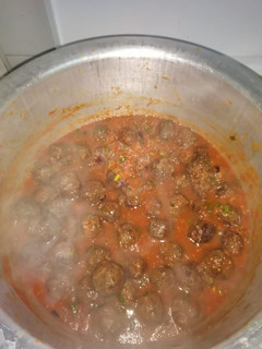 A picture of Meatballs in tomato sauce.