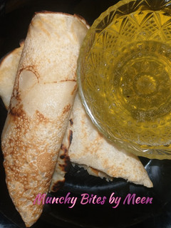 A picture of Meen's Pancake Rolls with Natural Orange Syrup.
