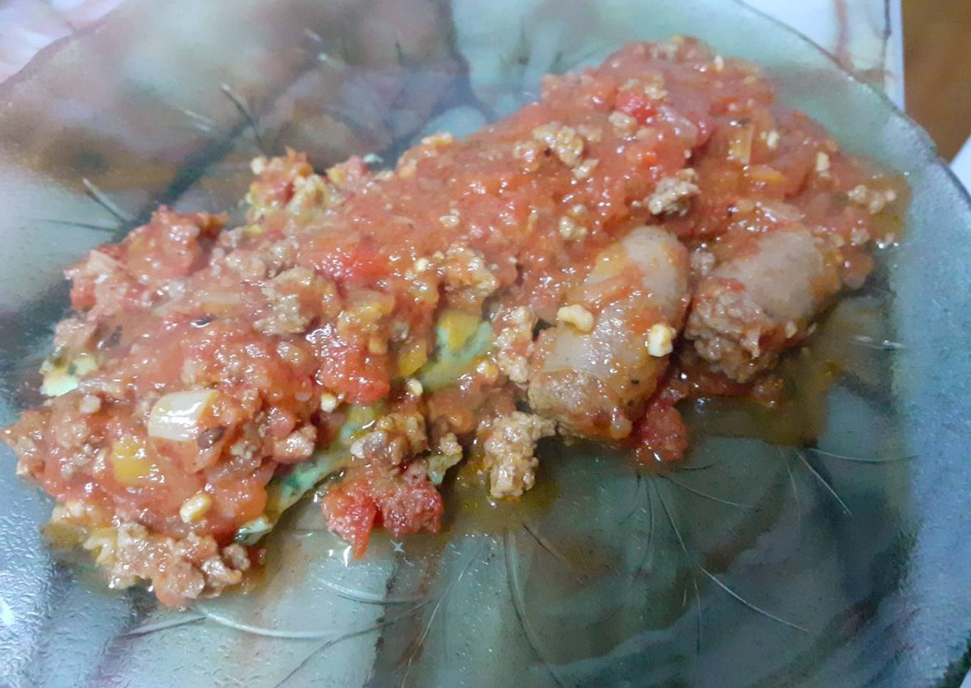 Canelones de espinaca con boloñesa y salchicha parrillera
