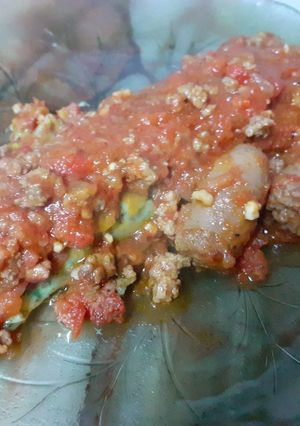 Una foto de Canelones de espinaca con boloñesa y salchicha parrillera
