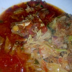 A picture of Beef Stew and fried Cabbages.