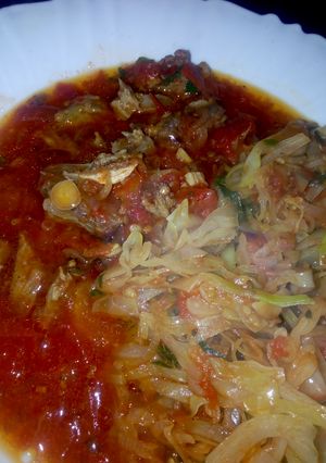 A picture of Beef Stew and fried Cabbages.