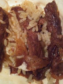 A picture of Steak Fajitas with Queso Cheese Sauce.