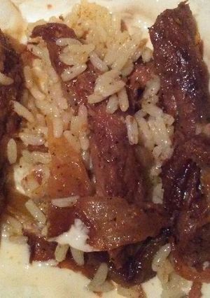 A picture of Steak Fajitas with Queso Cheese Sauce.