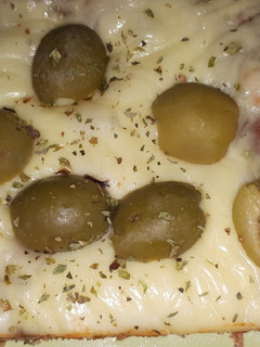 Una foto de Pizza de masa integral
