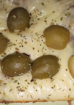 Una foto de Pizza de masa integral