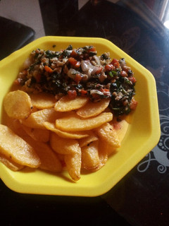 A picture of Chips and veggie-egg sauce.