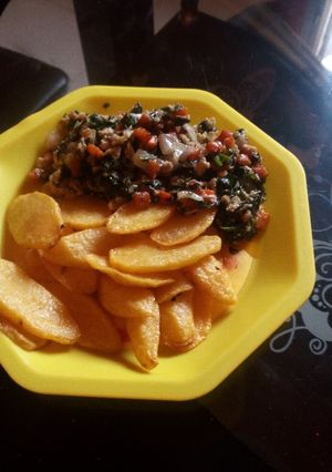 A picture of Chips and veggie-egg sauce.