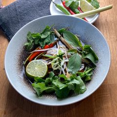 A picture of Seasonal Veggie Tom Yum Soup with Herbs 🌱.