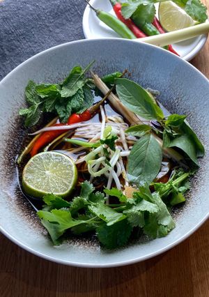 A picture of Seasonal Veggie Tom Yum Soup with Herbs 🌱.