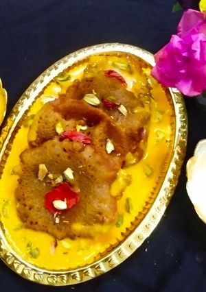 A picture of Royal Malpua with Mango Rabdi.