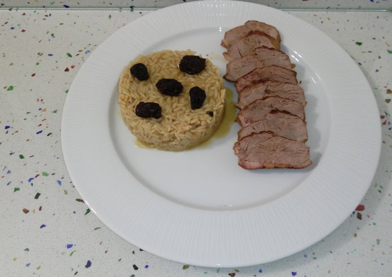 Pato al cava con miel y arroz con arándanos