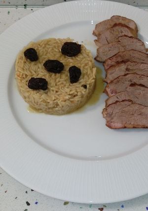 Una foto de Pato al cava con miel y arroz con arándanos