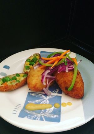 Una foto de Papa rellena de verduras