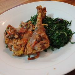 A picture of Fried Chicken and fried Kales.