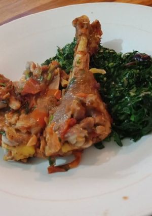 A picture of Fried Chicken and fried Kales.