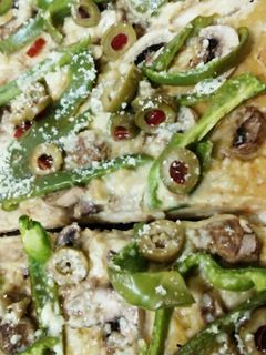 Una foto de Pizza Vegetariana con Hummus