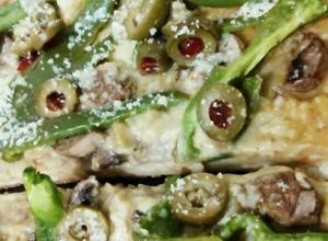 Una foto de Pizza Vegetariana con Hummus