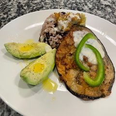 A picture of Fry eggplant with rice and black beans.