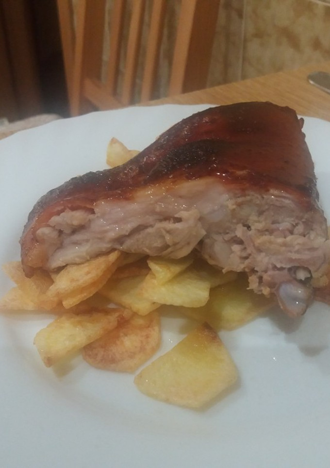 Una foto de Cochinillo asado