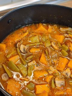 Una foto de Calabaza con champiñones y judías verdes
