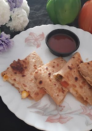 A picture of Mexican cheesy quesadilla.