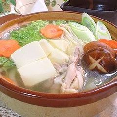 A picture of Simple Clear Dashi Stock Hot Pot with Lots of Napa Cabbage.
