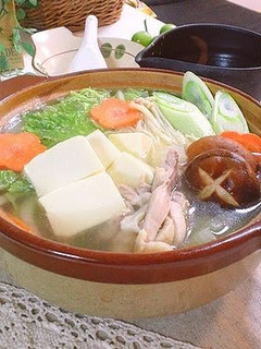 A picture of Simple Clear Dashi Stock Hot Pot with Lots of Napa Cabbage.