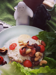 A picture of Fried egg with roasted nuts.