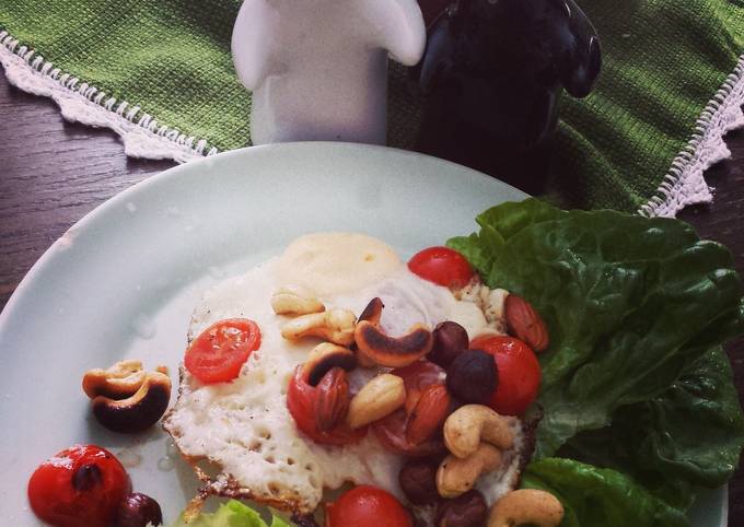 Fried egg with roasted nuts