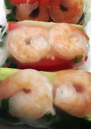 A picture of Shrimp spring rolls with pb2 sweet chili sauce.