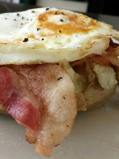 A picture of Bacon and Egg stuffed potatoes.