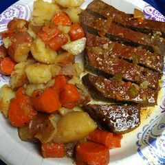 A picture of Roasted London Broil with vegetables.