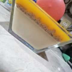 Una foto de Panna Cotta con Coulis de Durazno