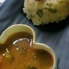 A picture of Vegetable Upma with Sambhar.