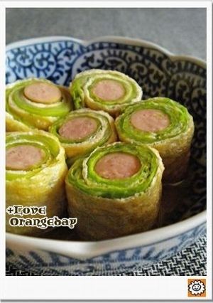 A picture of Rolled Cabbage with Fried Tofu and Wiener Sausages.