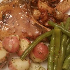 A picture of Pork Chops Apples and Onions.
